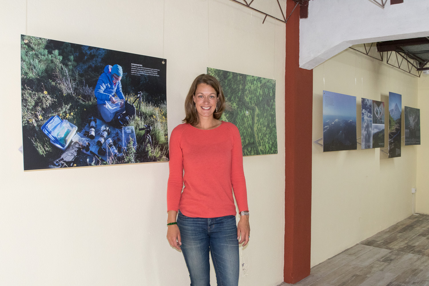 Stephanie standing within the exhibit space after preparing the space for the opening.